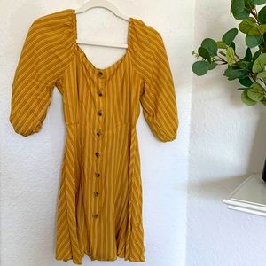 Gently used balloon sleeve mustard colored mini dress with pin stripes.